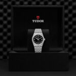 Stunning Tudor watch in elegant black box, showcasing luxury craftsmanship and timeless design.
