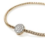 Elegant gold bracelet with sparkling diamond centerpiece, perfect for any occasion.