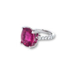 Elegant pink gemstone ring with diamonds, perfect for engagement or special occasions.