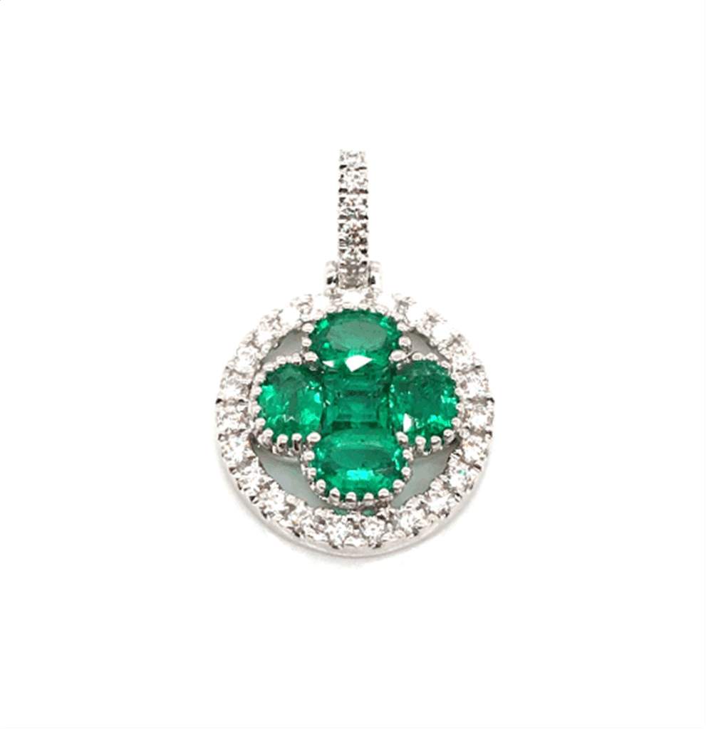Elegant emerald and diamond pendant, featuring a striking cross design in polished white metal.