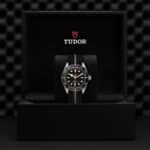 Tudor luxury watch in elegant black box with striking design and rich details.