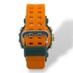 Durable G-Shock watch with vibrant orange strap and green case, perfect for outdoor adventures.