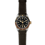 Tudor stainless steel watch features a black dial, rotating bi-colored bezel, and leather strap.