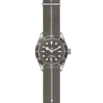 Sophisticated Tudor watch with stainless steel case, black bezel, brown dial, and fabric strap.