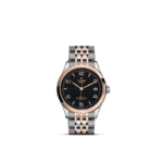 Stylish Tudor watch with black dial, rose gold accents, and stainless steel bracelet.