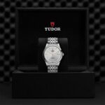 Tudor watch in elegant presentation case featuring a silver dial and stainless steel bracelet.