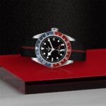 Tudor GMT watch with black dial, snowflake hands, and dual-color bezel, stylish and functional.