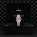 Elegant Tudor wristwatch displayed in a luxurious presentation box, showcasing timeless craftsmanship.