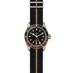 Elegant Tudor watch with black face, gold accents, and fabric strap for stylish everyday wear.
