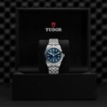 Elegant Tudor watch with blue dial in luxurious presentation box, perfect for collectors.