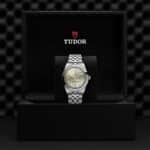 Tudor watch in elegant box showcases luxury, craftsmanship, and modern design.