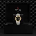 Elegant Tudor watch in a luxurious black box, showcasing timeless design and premium craftsmanship.