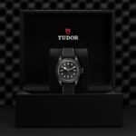 Tudor watch in elegant black box, showcasing luxury craftsmanship and modern design.