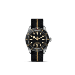 Tudor vintage dive watch features a black dial, luminous markers, and a durable fabric strap.