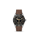 Tudor dive watch with stainless steel case and leather strap, blending elegance and durability.