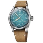 Oris watch features a turquoise dial, big crown, and brown leather strap for timeless elegance.