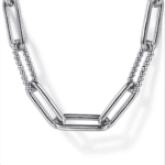 Modern silver necklace with interlinked rectangular links and spherical beads for stylish accessorizing.