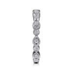 Elegant diamond ring with alternating round and teardrop shapes in white gold or platinum.