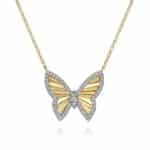 Elegant butterfly pendant in gold and diamonds, perfect for any jewelry collection or occasion.