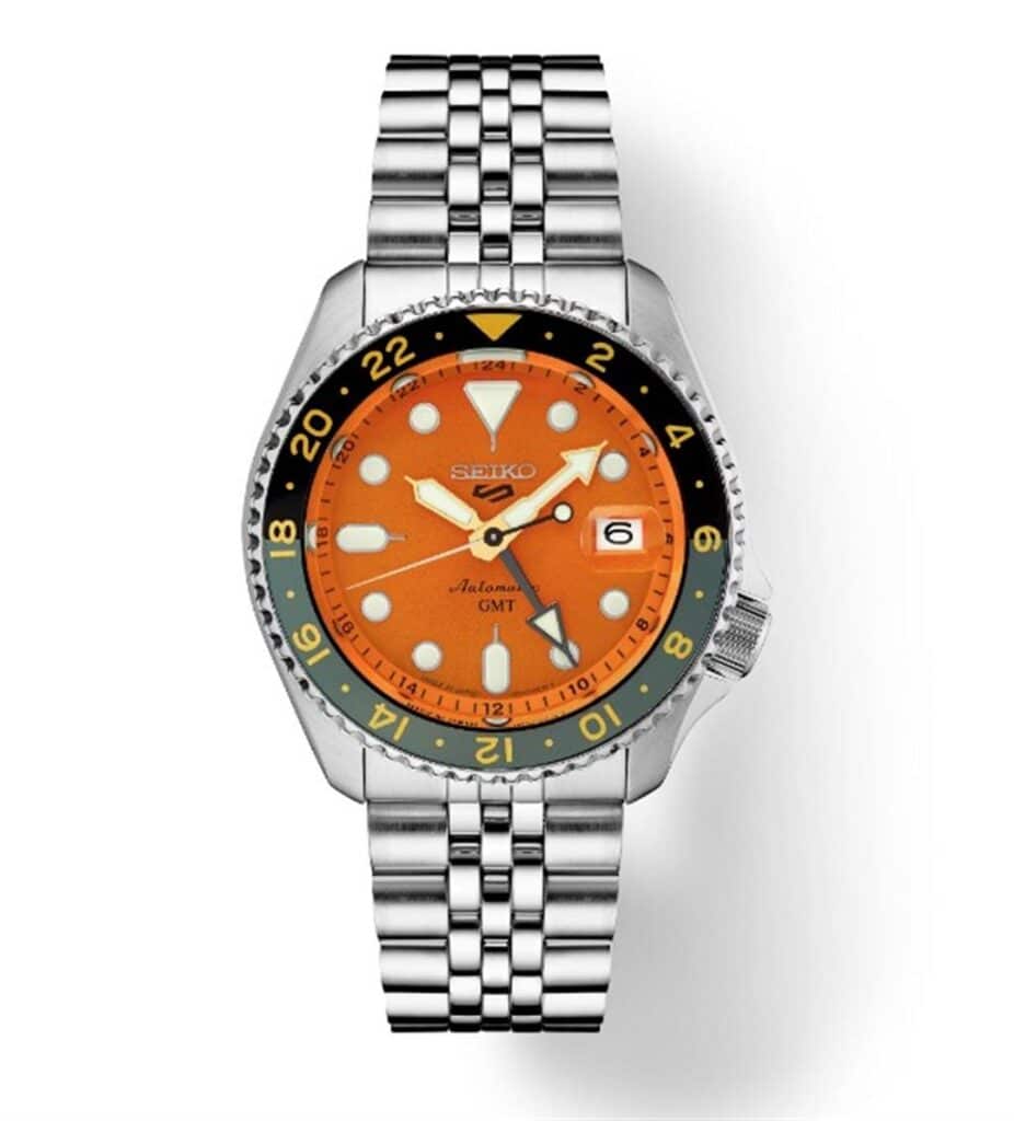 Seiko GMT watch features a vibrant orange dial, stainless steel case, and durable bracelet.