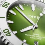 Stylish Oris Aquis watch with vivid green dial and robust diving features.