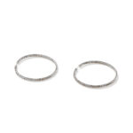 Elegant silver hoop earrings with textured detailing, perfect for versatile styling and timeless appeal.