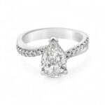 Elegant pear-shaped diamond engagement ring with sparkling accent stones in a unique design.