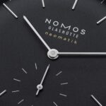Elegant NOMOS Glashütte neomatik watch dial showcases modern design and precision craftsmanship.