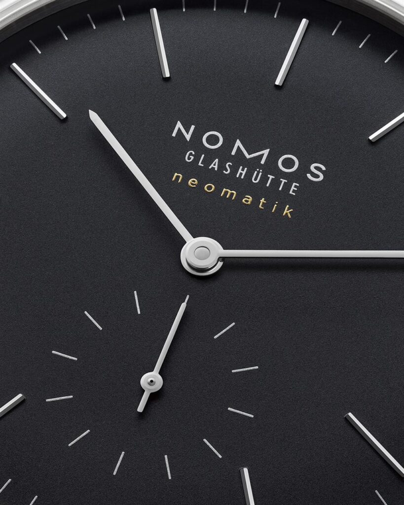 Elegant NOMOS Glashütte neomatik watch dial showcases modern design and precision craftsmanship.