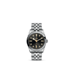 Tudor stainless steel watch with black dial and gold accents, stylish and water-resistant timepiece.