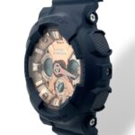 Durable Casio G-Shock watch features a stylish rose gold face and textured black resin strap.