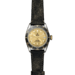 Classic Tudor watch with stainless steel case, gold dial, and leather strap for adventurers.