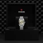 Luxurious Tudor wristwatch in elegant presentation box, showcasing timeless craftsmanship and sophisticated design.