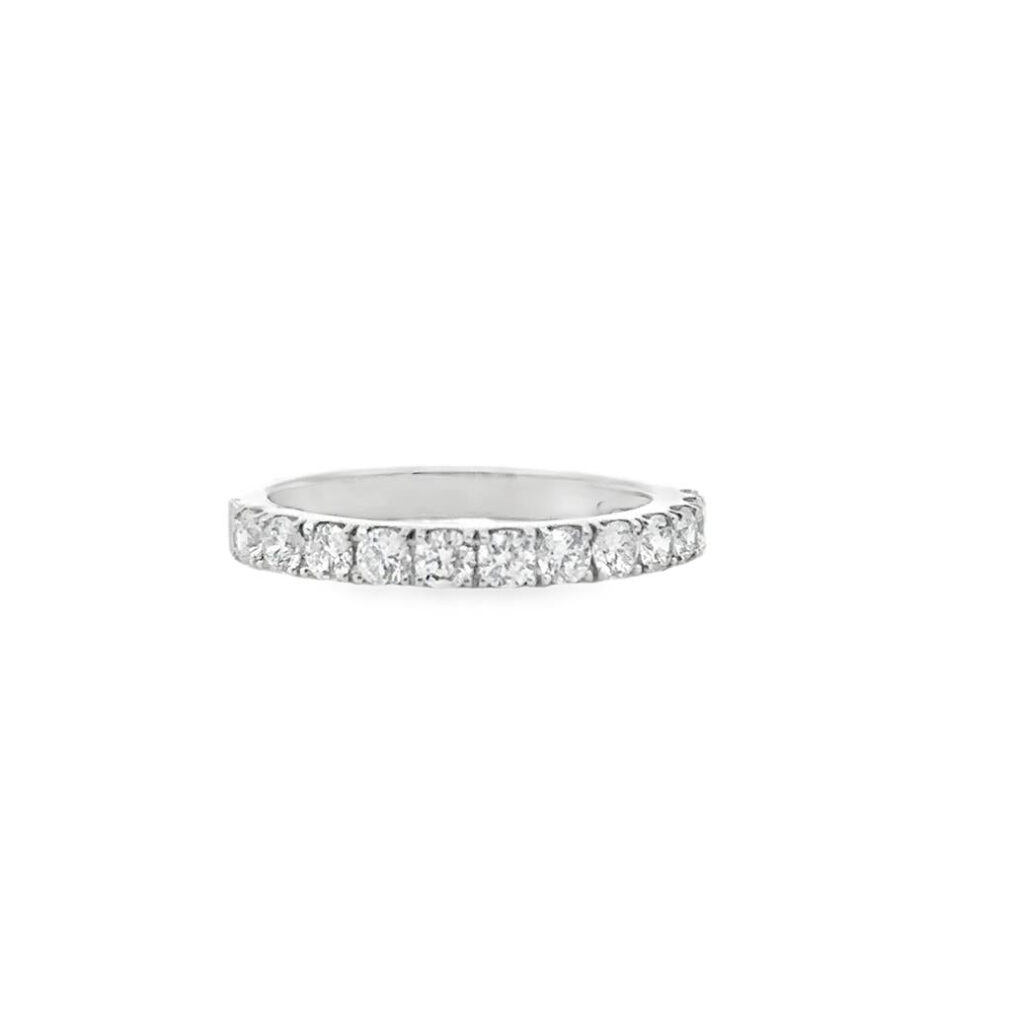 Elegant diamond band ring in white metal, perfect for engagements and timeless fashion.