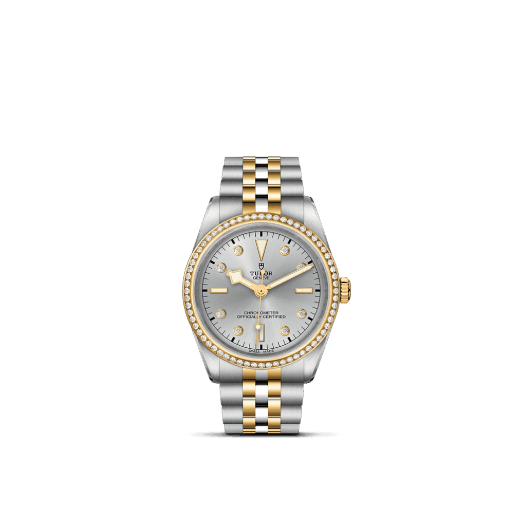 Tudor luxury watch with diamond bezel, silver dial, and gold accents for elegant style.