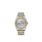 Tudor luxury watch with diamond bezel, silver dial, and gold accents for elegant style.