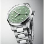 Stylish Oris wristwatch with a green dial, stainless steel case, and brushed metal bracelet.