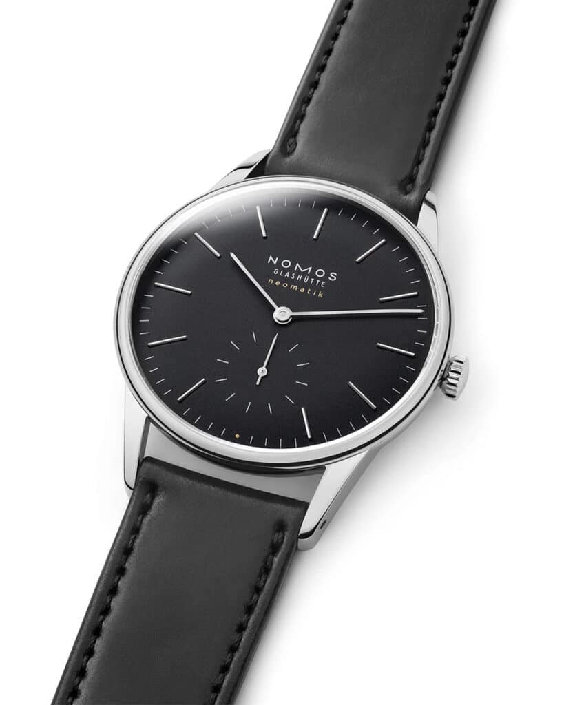 Elegant Nomos Glashütte watch featuring a black dial, stainless steel case, and luxury leather strap.