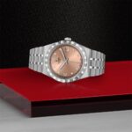 Elegant Tudor watch in rose gold and stainless steel, showcasing luxury craftsmanship and design.