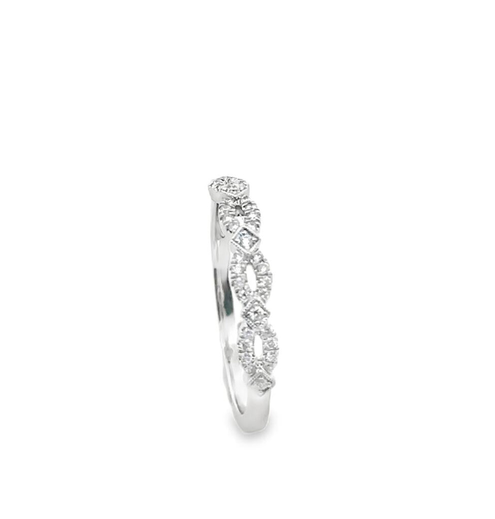 Elegant white metal ring with sparkling diamonds, perfect for engagements or stylish occasions.
