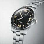 Elegant Oris dive watch features a black dial, luminous markers, and a stainless-steel bracelet.