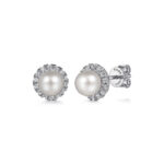 Elegant pearl earrings with halo of sparkling stones, perfect for any occasion.