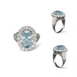 Elegant ring featuring a light blue gemstone and diamonds, perfect for engagements or special occasions.