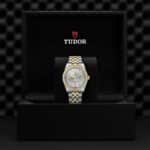 Luxurious Tudor watch in elegant box showcasing exquisite craftsmanship and sophisticated design.