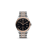 Elegant Tudor watch with black dial, rose gold accents, and stainless steel bracelet.