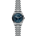 Elegant Tudor watch with blue dial, stainless steel case, and luminescent markers for precision.