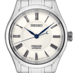 Elegant Seiko Presage automatic watch with stainless steel case, ivory dial, and blue accents.
