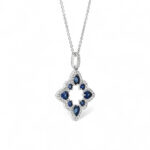 Elegant silver pendant with blue sapphire gemstones, perfect for stylish occasions and jewelry collections.