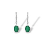 Elegant emerald earrings with diamonds, showcasing vibrant green stones in a modern design.