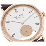 Elegant NOMOS Glashütte rose gold watch with minimalist design and classic leather strap.
